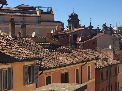 a view of roofs of buildings in a city at MGPgroup Have a Nice Day in Rome