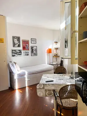 a living room with a white couch and a table at MGPgroup Have a Nice Day in Rome