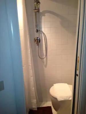 a bathroom with a toilet and a shower at Small Navona Studio in Rome