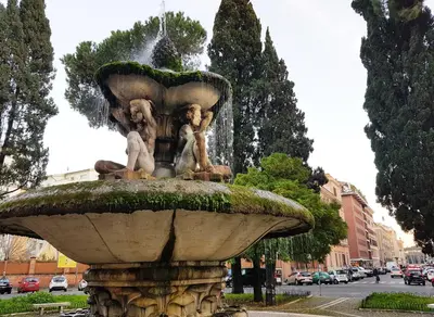 a fountain with two statues on top of it at More Cola di Rienzo B&B in Rome