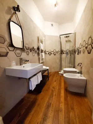 a bathroom with a sink and a shower and a toilet at More Cola di Rienzo B&B in Rome