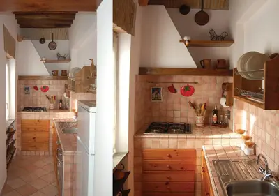 a kitchen with a sink and a stove top oven at Panoramic Apartment in Rome