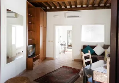 a living room with a couch and a table at Panoramic Apartment in Rome