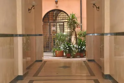 an entrance to a building with potted plants at Simon's place in Rome