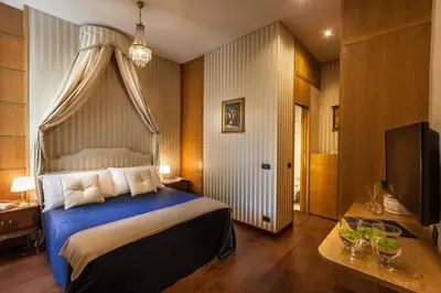 a hotel room with a bed and a television at Prestigious Apartment Piazza Navona in Rome