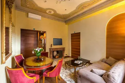 a living room with a couch and a table at Prestigious Apartment Piazza Navona in Rome