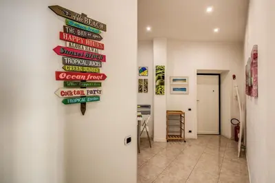 a hallway with signs on the wall of a building at GreenSugarHome in Rome