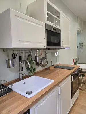 a kitchen with a sink and a microwave at Rome Candia Holiday House in Rome
