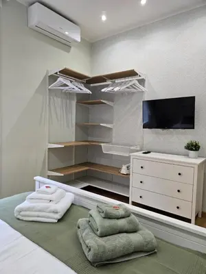 a pair of towels sitting on top of a bed at Rome Candia Holiday House in Rome