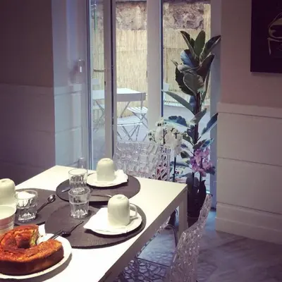 a dining room table with plates and food on it at Tuttelestrade - The apartment in Rome