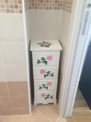 a white dresser with flowers on it in a bathroom at La casa per te in Rome