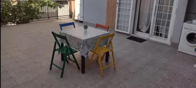a table and chairs sitting on a patio at La casa per te in Rome