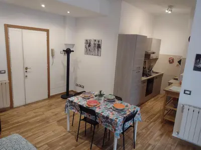 a kitchen with a table with plates on it at La casa per te in Rome