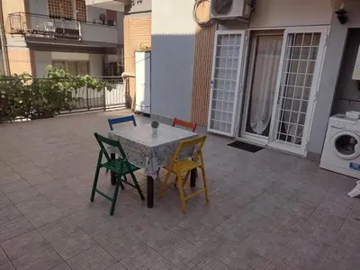 a table and chairs sitting on a patio at La casa per te in Rome