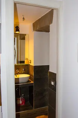 a bathroom with a sink and a mirror at La Casa di Marti in Rome