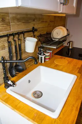 a kitchen counter with a white sink on a counter top at La Casa di Marti in Rome