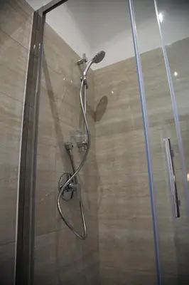 a shower in a bathroom with a glass door at B&B Federica's House In Rome in Rome