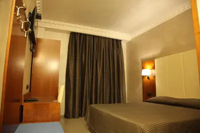 a hotel room with a bed and a window at B&B Federica's House In Rome in Rome