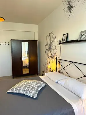 a bedroom with a large bed in a room at Eufonia Vinyl Friendly Apartment in Rome