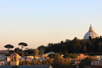 a view of a city with a dome in the background at Eufonia Vinyl Friendly Apartment in Rome
