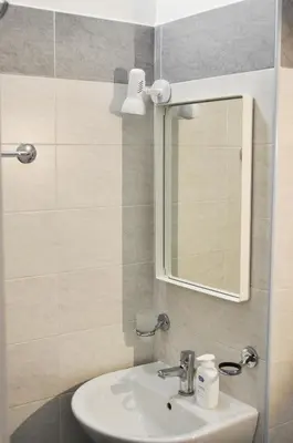 a bathroom with a sink and a mirror at 