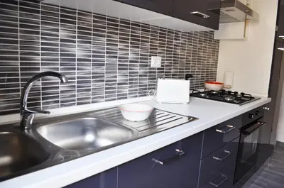 a kitchen with a sink and a stove at 