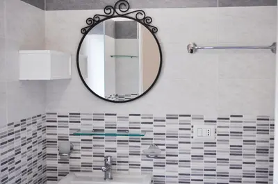 a bathroom with a mirror and a sink at 