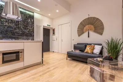 a living room with a couch and a table at Private Apartment Colosseum in Rome