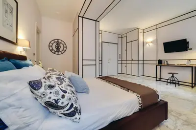 a bedroom with a bed with a pillow on it at Repubblica Central Suite in Rome