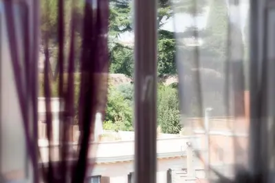 a window with a view of a building at Luxury Domus Amadeus in Rome