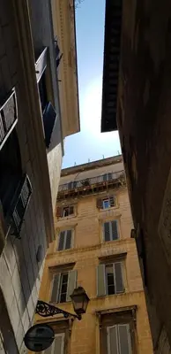 a view of a tall building from the street at Campo de Fiori House in Rome