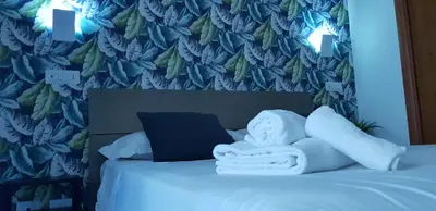 a bedroom with a bed with towels on it at Campo de Fiori House in Rome