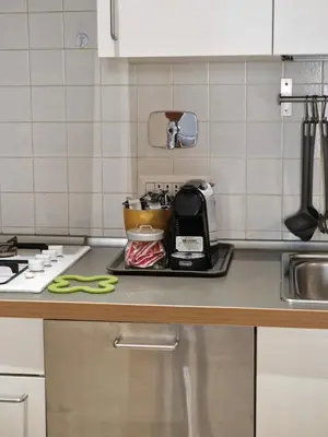 a kitchen counter with a toaster on a counter top at Campo de Fiori House in Rome