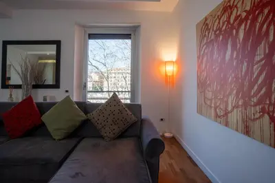 a living room with a couch and a window at PgrHome Riverside in Rome