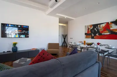 a living room with a couch and a table at PgrHome Riverside in Rome