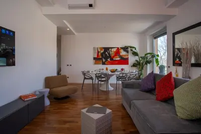 a living room with a couch and a table at PgrHome Riverside in Rome