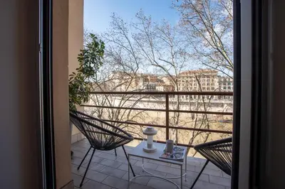 a view of a balcony with two chairs and a table at PgrHome Riverside in Rome