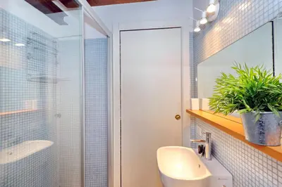 a bathroom with a toilet and a sink and a shower at Parione Charme - My Extra Home in Rome
