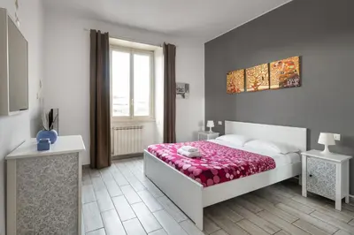 a bedroom with a bed and a window at Lilli Home Holidays in Rome