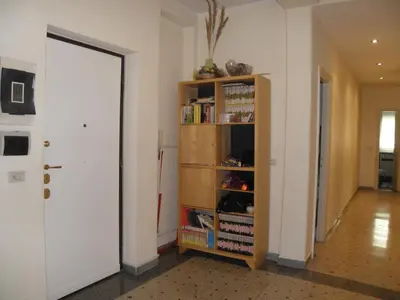 a room with a book shelf with books at Magnifico Cozy Apartment 400m da metroB in Rome