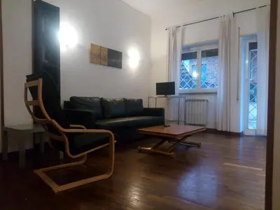 a living room with a couch and a coffee table at La Casa di Nonna Betta in Rome