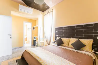 a bedroom with a large bed in a room at B&B Casa Torpì in Rome