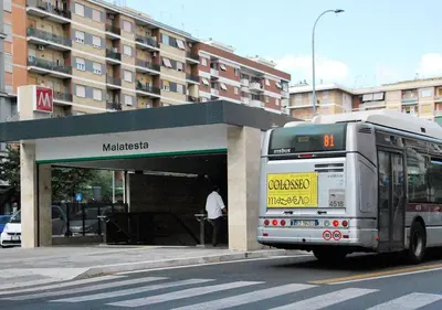 a bus is parked at a bus stop at B&B Casa Torpì in Rome