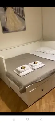 a bed with two towels on top of it at CASA VACANZA COLOSSEO WHOLE HOLIDAY HOME APARTMENT da PAMINO & PRISCILLA in Rome