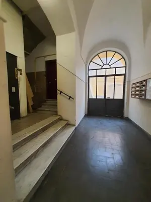 an empty room with a door and a window at CASA VACANZA COLOSSEO WHOLE HOLIDAY HOME APARTMENT da PAMINO & PRISCILLA in Rome