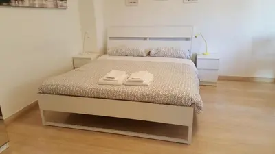 a bedroom with a bed with two towels on it at C'è posto per te in Rome