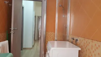 a bathroom with a toilet and a shower and a sink at C'è posto per te in Rome