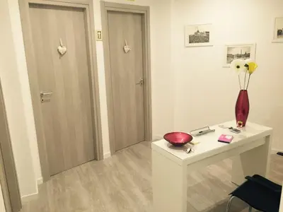 a room with a table with a vase on it at Affittacamere Roma Tiburtina in Rome