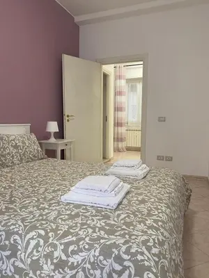 a bedroom with a bed with two towels on it at Casa Vacanze Marzia in Rome
