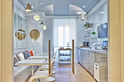 a dining room with a table and some chairs at Vatican Chic B&B in Rome